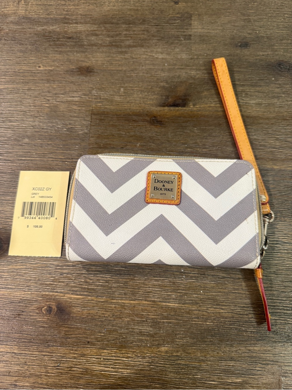 Dooney & Bourke Gray and White Chevron Wristlet with Leather Strap.  Used.